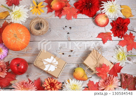 Happy Thanksgiving concept, postcard Autumn background with seasonal pears, pumpkins, apples and flowers on wooden background, copy space, selective focus. Harvesting, gifts of nature 130584548
