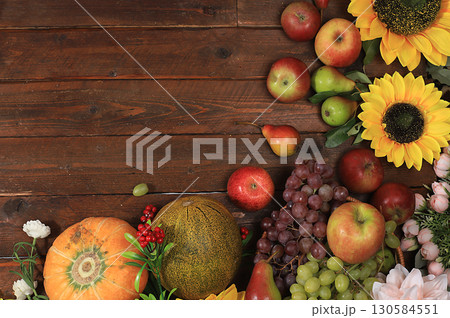 Happy Thanksgiving concept, postcard. Autumn background with seasonal pears, pumpkins, apples and flowers on wooden background, copy space, selective focus. Harvesting, gifts of nature, place for text 130584551