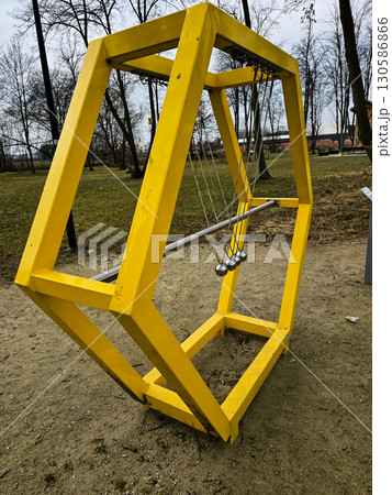 Interactive Science Park Exhibit with Newton's Cradle, Plasma Balls and Physics Experiments 130586866