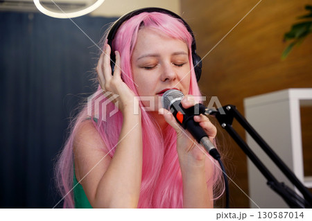 Beautiful young singer and musician broadcast from her home studio 130587014