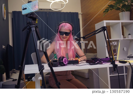 Beautiful young singer and musician broadcast from her home studio 130587190