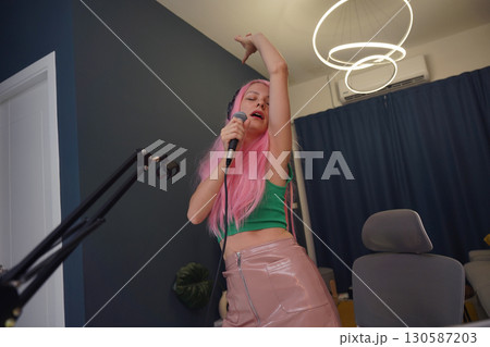 Beautiful young singer and musician broadcast from her home studio Beautiful young singer and musician broadcast from her home studio 130587203