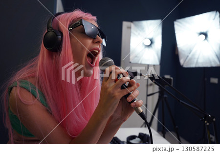 Beautiful young singer and musician broadcast from her home studio 130587225