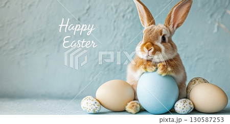 Cute rabbit with colorful eggs celebrating Easter holiday in cheerful setting,  130587253