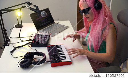 Beautiful young singer and musician broadcast from her home studio Beautiful young singer and musician broadcast from her home studio 130587403