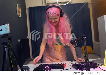 Beautiful young singer and musician broadcast from her home studio Beautiful young singer and musician broadcast from her home studio 130587405