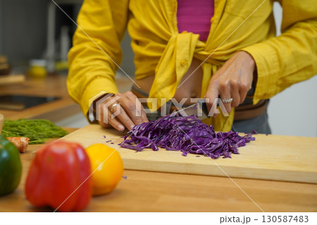 Young woman is broadcasting live from workshop how to prepare a vegetarian food 130587483