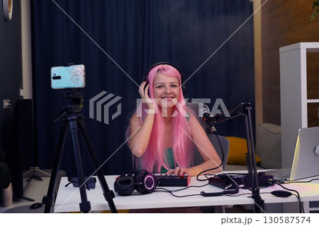 Beautiful young singer and musician broadcast from her home studio Beautiful young singer and musician broadcast from her home studio 130587574