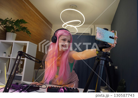 Beautiful young singer and musician broadcast from her home studio Beautiful young singer and musician broadcast from her home studio 130587743