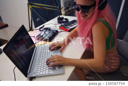 Beautiful young singer and musician broadcast from her home studio 130587754