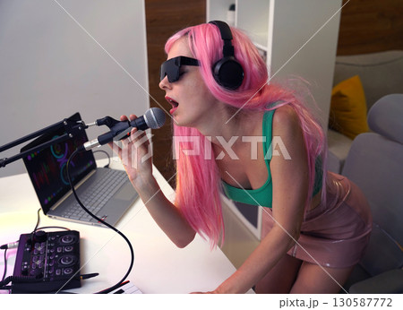 Beautiful young singer and musician broadcast from her home studio Beautiful young singer and musician broadcast from her home studio 130587772