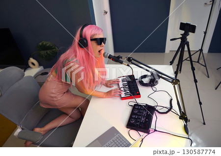 Beautiful young singer and musician broadcast from her home studio Beautiful young singer and musician broadcast from her home studio 130587774