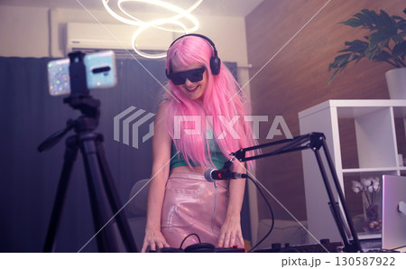 Beautiful young singer and musician broadcast from her home studio Beautiful young singer and musician broadcast from her home studio 130587922