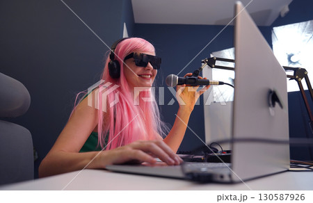 Beautiful young singer and musician broadcast from her home studio Beautiful young singer and musician broadcast from her home studio 130587926