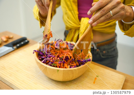 Young woman is broadcasting live from workshop how to prepare a vegetarian food 130587979