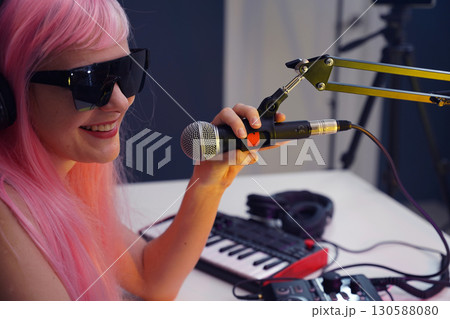 Beautiful young singer and musician broadcast from her home studio Beautiful young singer and musician broadcast from her home studio 130588080
