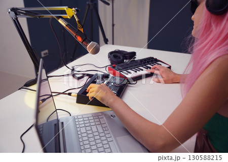 Beautiful young singer and musician broadcast from her home studio 130588215