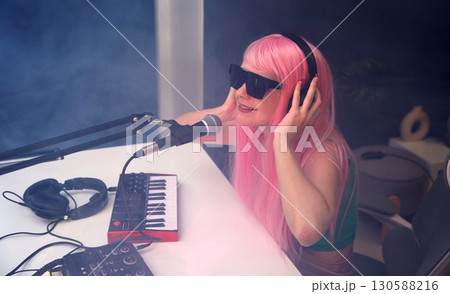 Beautiful young singer and musician broadcast from her home studio Beautiful young singer and musician broadcast from her home studio 130588216