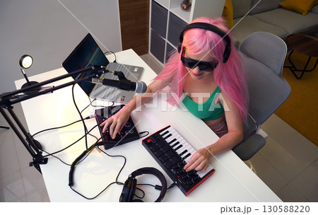 Beautiful young singer and musician broadcast from her home studio Beautiful young singer and musician broadcast from her home studio 130588220