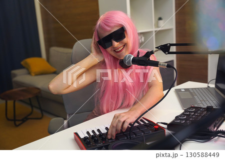 Beautiful young singer and musician broadcast from her home studio Beautiful young singer and musician broadcast from her home studio 130588449