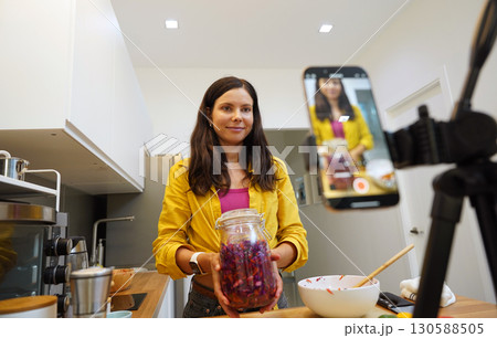 Young woman is broadcasting live from workshop how to prepare a vegetarian food 130588505