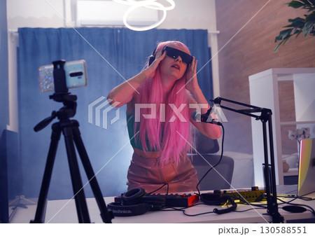 Beautiful young singer and musician broadcast from her home studio Beautiful young singer and musician broadcast from her home studio 130588551