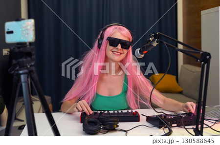 Beautiful young singer and musician broadcast from her home studio 130588645