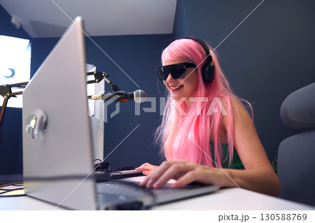 Beautiful young singer and musician broadcast from her home studio 130588769