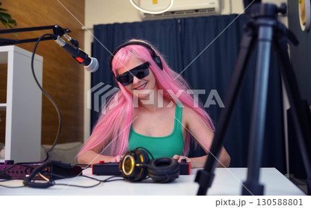 Beautiful young singer and musician broadcast from her home studio Beautiful young singer and musician broadcast from her home studio 130588801