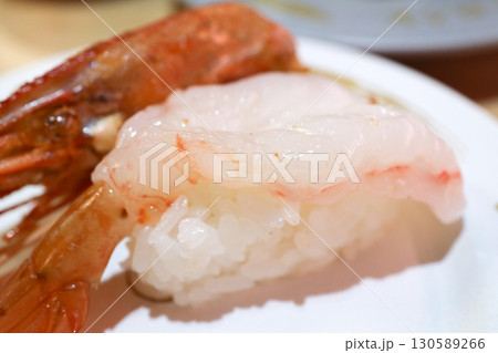 Fresh Nigiri Sushi with Sweet Shrimp and Grilled Head on Plate 130589266