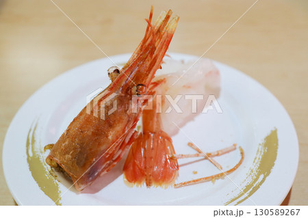Fresh Nigiri Sushi with Sweet Shrimp and Grilled Head on Plate Fresh Nigiri Sushi with Sweet Shrimp and Grilled Head on Plate 130589267