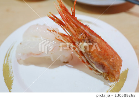 Fresh Nigiri Sushi with Sweet Shrimp and Grilled Head on Plate 130589268