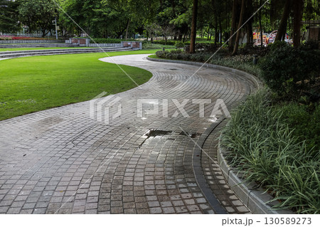 Pathway Through a Green Park in a Peaceful Urban Area Pathway Through a Green Park in a Peaceful Urban Area 130589273