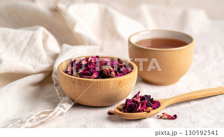 Dried Roses in Wooden Cup with Rose Tea Dried Roses in Wooden Cup with Rose Tea 130592541