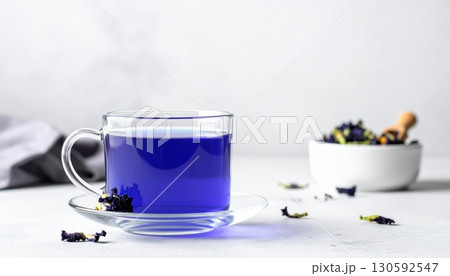 Butterfly Pea Flower Tea in Clear Glass with Minimalist Background Butterfly Pea Flower Tea in Clear Glass with Minimalist Background 130592547