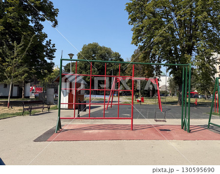Empty playground with swings and climbing frames. Urban infrastructure and childhood leisure. Empty playground with swings and climbing frames. Urban infrastructure and childhood leisure. 130595690