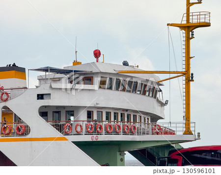 Close-up of passenger ferry with lifebuoys and deck view. Public transport, maritime safety, and everyday life on Bosphorus. 130596101