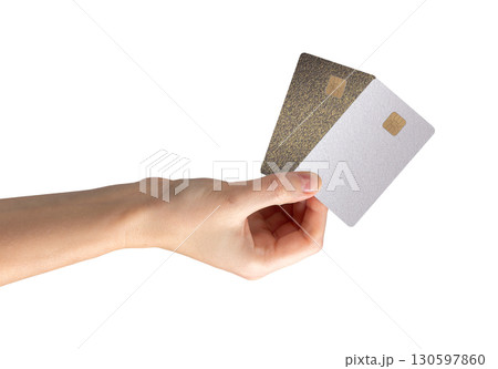Card held in hand with chip visible. Payment, credit, cashback, salary, finance, commerce, revenue, 130597860