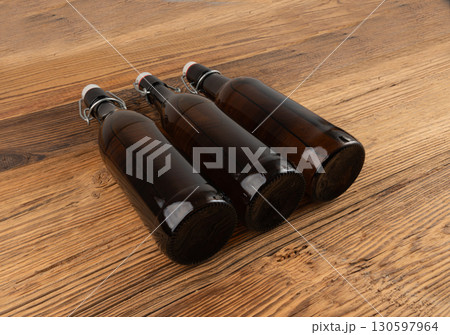 Old beer bottle, brown glass vintage beerbottle, a quality traditional time-tested drink symbol 130597964