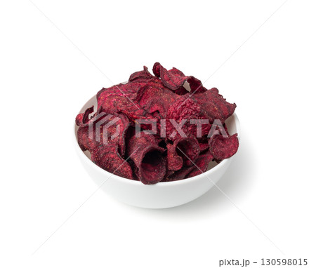Dry beetroot chips isolated, dried sliced red beet flakes pile, beet root pieces and chips Dry beetroot chips isolated, dried sliced red beet flakes pile, beet root pieces and chips 130598015