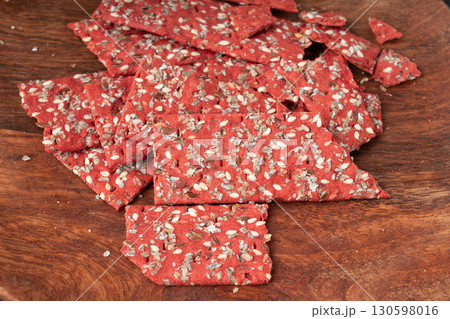 Beetroot crackers, thin rusk beet root bread, red diet multigrain crispbread, various seeds Beetroot crackers, thin rusk beet root bread, red diet multigrain crispbread, various seeds 130598016