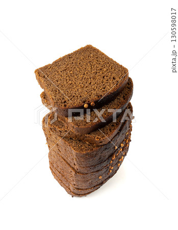 Black rye bread isolated, dark brown sliced loaf, sourdough borodinsky rugbrod square slices 130598017
