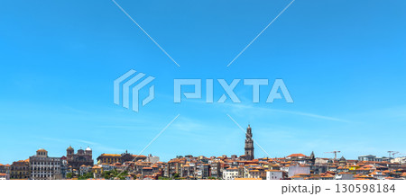 Porto cityscape with Clerigos tower, traditional rooftops, red tiles, baroque architecture, dense Porto cityscape with Clerigos tower, traditional rooftops, red tiles, baroque architecture, dense 130598184