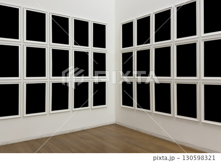 Modern art gallery interior with multiple empty black frames on white walls. Minimalist exhibition 130598321