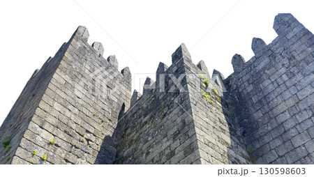 Medieval fortress walls of Guimaraes Castle in Portugal, isolated on white background. The stone Medieval fortress walls of Guimaraes Castle in Portugal, isolated on white background. The stone 130598603