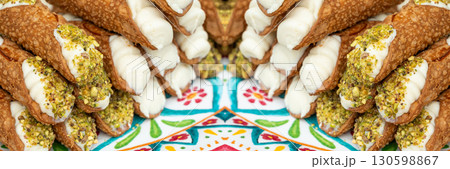 Cannoli with pistachios and ricotta. Sicilian dessert cannolo, fresh sweet cannoli pile 130598867