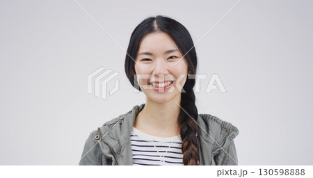 Portrait, confident and woman with smile, studio and positive attitude for education or opportunity. Happy, student and Asian person with scholarship for knowledge, white background and university 130598888
