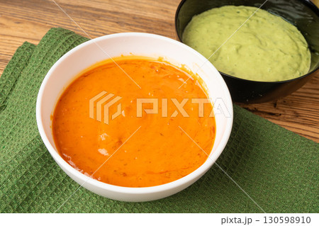 Red mojo rojo and green mojo verde sauces, traditional Tenerife dips, mojo picon dressing 130598910