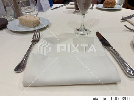 Cutlery with fork, knife and napkin Cutlery with fork, knife and napkin 130598911