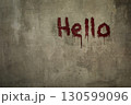 Art shabby grey plastered wall with the inscription hello in blood, copy space. 130599096